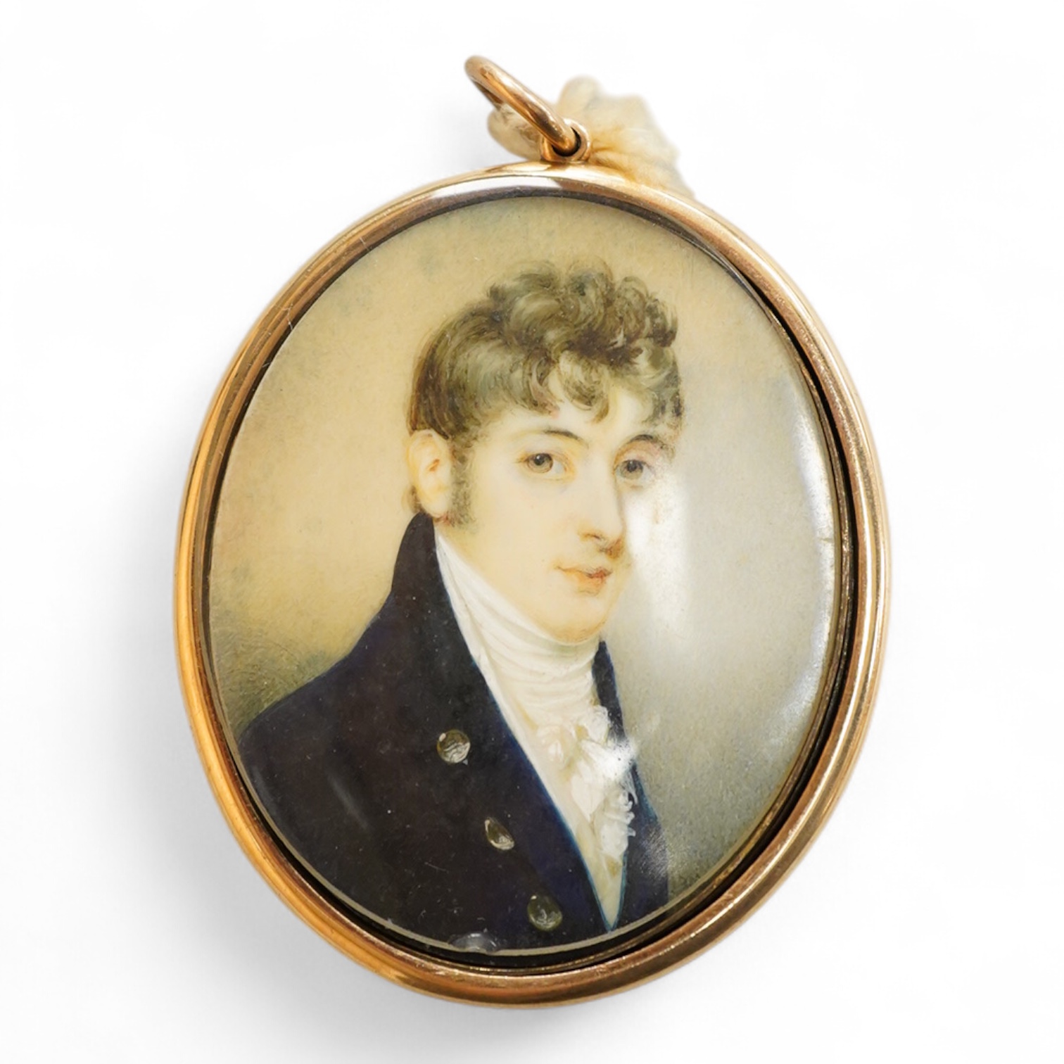 Regency School, Portrait miniature of a young gentleman, oval watercolour on ivory, housed in a yellow metal pendant frame with hairwork panel verso, glass loose, overall 7cm high - IVORY SUBMISSION BKCK66FM
